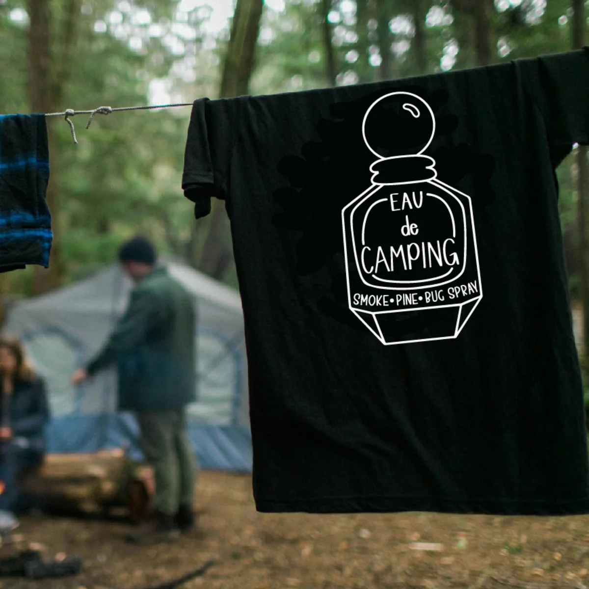 Black t-shirt with the Eau de Camping perfume bottle design
