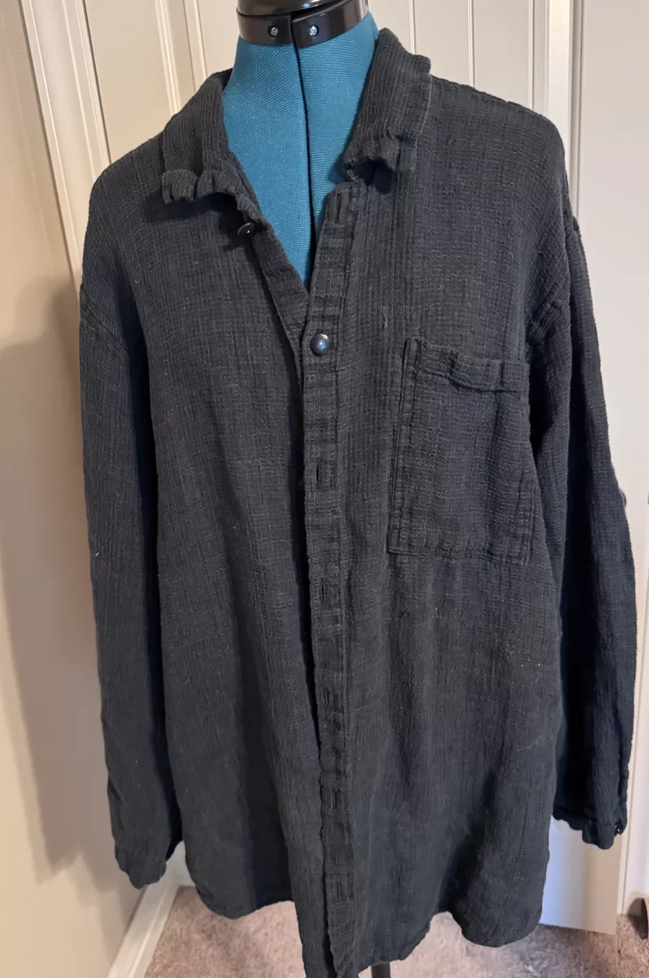 A full thrifted shirt ready to be tried on at home