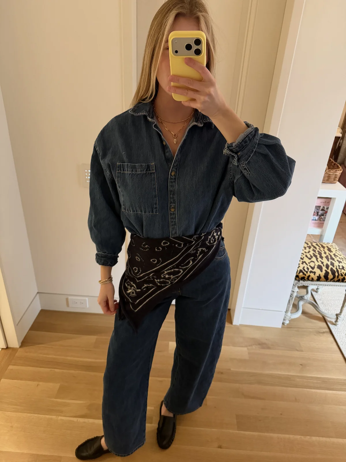 On-model looks pairing dark-wash denim with sweaters and tees for fall