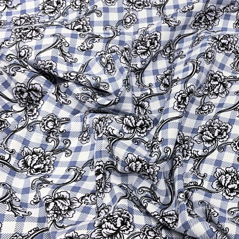 Repeating cartoon dogs on scooters pattern on soft gray fabric