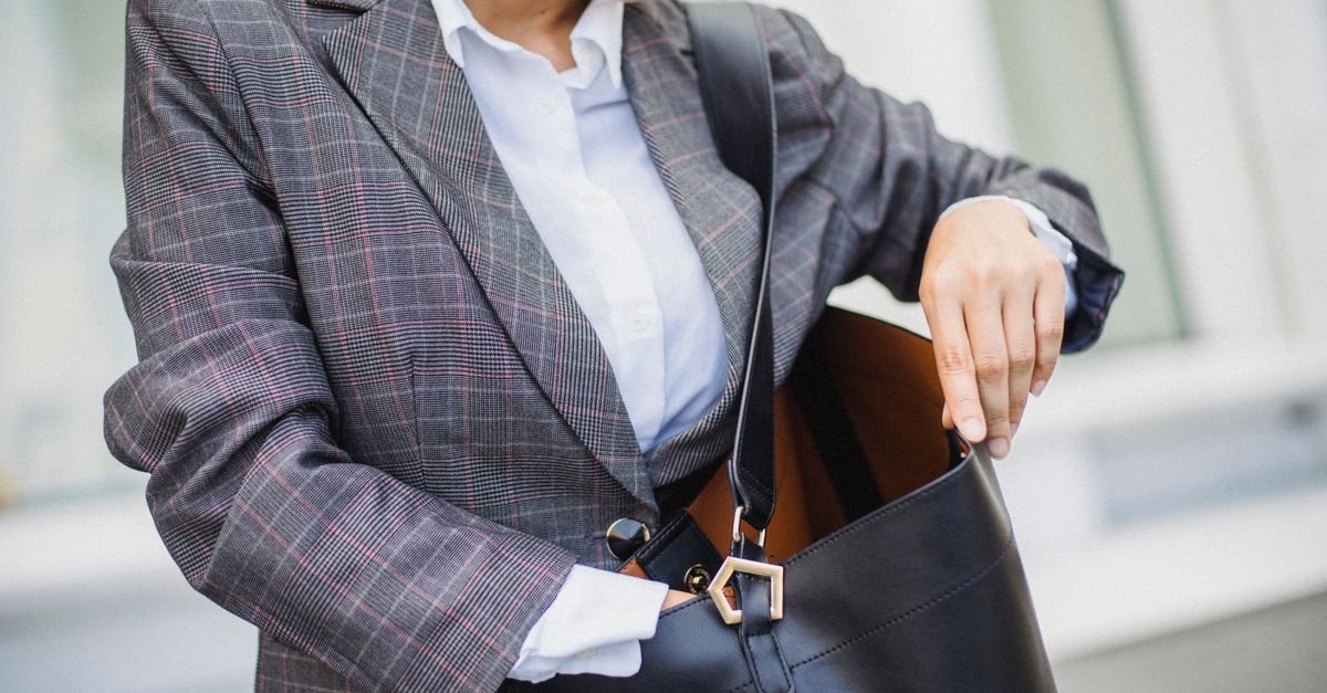 Plaid blazer over white oxford shirt with structured leather bag, preppy street style