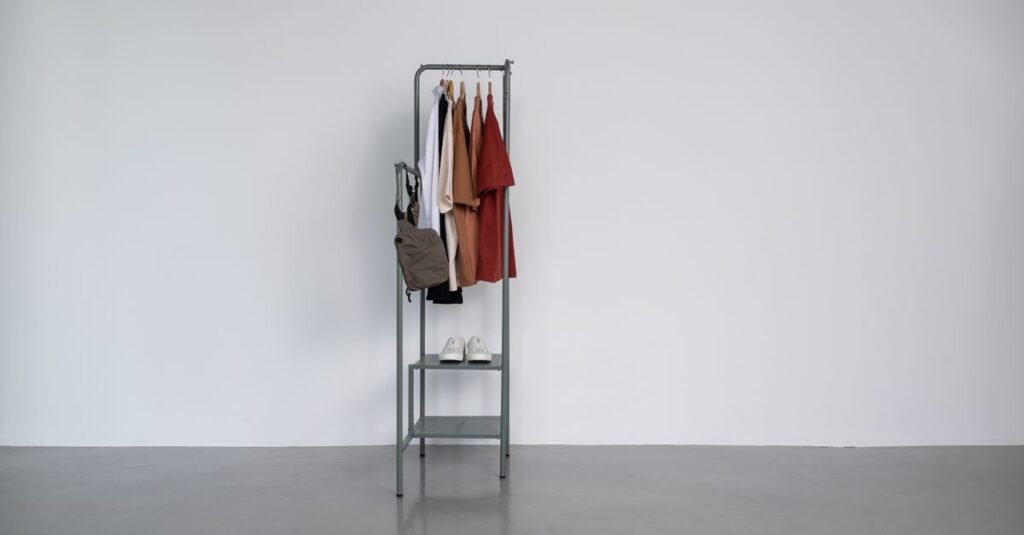 Minimalist fashion designer's studio with clean-lined garments on racks, soft natural light