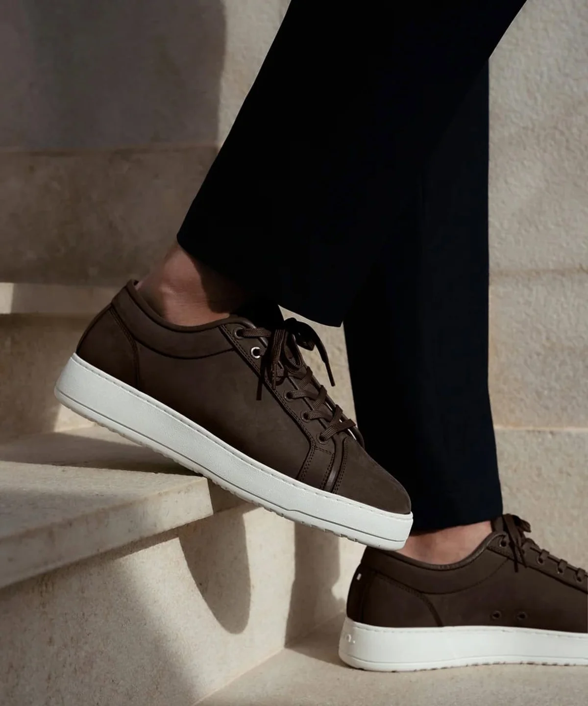 Brown nubuck low-top sneaker with white sole, side profile
